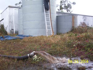 Galvanized iron water tank being cleaned