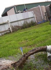 Plastic water tank sediment being removed